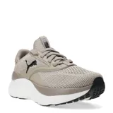 Championes Puma modelo Softride Mayve, con capellada de tejido respirable en color negro. Presenta entresuela blanca con detalles en verde agua y logo de la marca en plateado en el lateral.