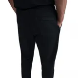 Pantalón de jogging negro de la Selección Uruguaya de Fútbol, con cintura elástica, puños en los tobillos y escudo de la AUF estampado en la pierna derecha.