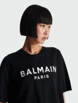 Remera corta negra de algodón con logo Balmain Paris estampado en blanco.