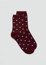 Medias bordó con estampado de lunares rosados y puño elástico acanalado.