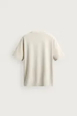 Camiseta de corte regular fit en mezcla de algodón y lino, con cuello redondo y manga corta de la colección Origins.
