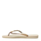 Sandalias tipo ojotas Havaianas modelo Slim Glitter II, color beige arena, con tiras finas cubiertas de glitter brillante.