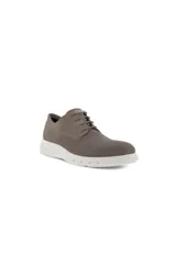Zapato tipo mocasín o derby de hombre, color taupe (gris/marrón topo), con capellada de malla texturizada y recortes de gamuza. Posee cordones finos y una suela blanca gruesa y deportiva.