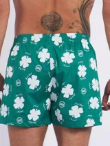 Bóxer de algodón blanco con estampado de flores pequeñas color celeste, con cintura elástica y logo de la marca en el centro.