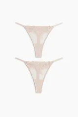 Pack de dos colaless de malla color nude con detalles de encaje y tiras finas ajustables en los laterales.