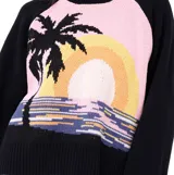 Buzo de punto Rip Curl con diseño de atardecer tropical, palmeras y olas. Presenta mangas largas en color negro, cuello redondo y puños acanalados.