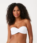 Soutien femenino modelo top, color piel, con copa hueca y tirantes removibles.