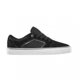 Championes de skate Emerica modelo Cadence, color negro con suela blanca. Presentan un diseño de perfil bajo con paneles laterales de tela y refuerzos de gamuza, ojal superior metálico dorado y logo de la marca en el lateral.