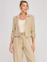 Pantalón holgado de lino color beige de la marca Allie Rose, con tiro alto y pretina elastizada con cordón de ajuste.