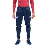 Pantalón de jogging azul marino con cortes en las piernas, escudo del Club Nacional de Football y logo de Umbro.