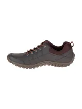 Zapato casual Cat modelo Instruct, confeccionado en cuero marrón con detalles en textil. Presenta cordones al tono, suela de goma flexible con relieve y logo de la marca en el lateral.
