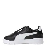 Championes urbanos Puma modelo Shuffle Downtown, de diseño clásico con exterior en cuero sintético negro, franja lateral blanca y suela de goma blanca. Incluye logo de la marca en dorado en el lateral.