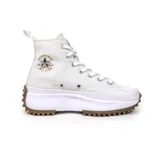 Championes Converse Run Star Hike color blanco con plataforma y suela marrón con diseño dentado.