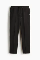 Pantalón tipo jogger de corte regular, confeccionado en tejido de punto de mezcla de algodón. Presenta cintura elástica con cordón de ajuste, pliegues frontales cosidos, bolsillos laterales y un bolsillo trasero insertado.