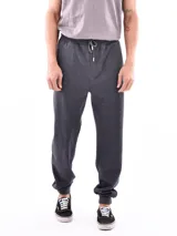 Pantalón de jogging gris oscuro con cintura elástica ajustable con cordón y puños ajustados.