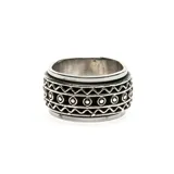 Anillo de plata 925 giratorio con diseño de círculos grabados y cenefas ornamentales.