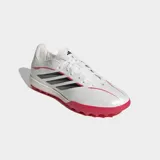Championes de fútbol Adidas modelo Copa Pure IV League Turf, diseñados para césped artificial. Presentan un diseño en color blanco perlado con las icónicas tres tiras en negro y detalles en rojo vibrante en la suela y laterales. Incorporan tecnología Fusionfeel en la parte superior para un mejor control del balón y una suela de goma con tapones diseñados para tracción en superficies sintéticas.