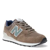 Championes urbanos New Balance modelo 574, color marrón con detalles en verde y azul, confeccionados en gamuza y malla, con logo "N" característico en los laterales y entresuela ENCAP.