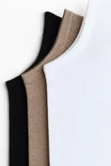 Pack de cinco soquetes de punto fino en colores negro, tostado y blanco, con borde superior elástico y mezcla de algodón con Lycra.