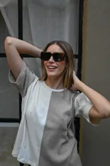 Lentes de sol con montura gruesa de forma cuadrada/rectangular, color verde oliva translúcido, y cristales tintados en tono ámbar/marrón claro.