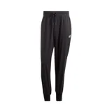 Pantalón de jogging Adidas color negro, de corte holgado, con cintura elástica ajustable con cordón, bolsillos laterales y logo de la marca estampado en la pierna izquierda. Confeccionado con tejido plano de poliéster suave y tecnología Aeroready de absorción de humedad.