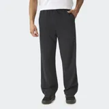 Pantalón de felpa de corte wide leg en color negro, con cintura elástica y bolsillos laterales.