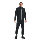 Campera deportiva Under Armour de corte clásico, confeccionada en tejido tricot texturizado. Presenta cuello alto, cierre frontal completo en color blanco y logo de la marca estampado en el pecho.