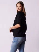 Buzo azul de tejido acanalado marca Ninety, con mangas cortas japonesas.