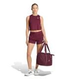 Top deportivo Adidas color bordó, de corte crop y diseño sin mangas con cuello redondo.