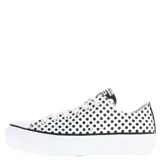 Championes Converse Chuck Taylor All Star Lift con plataforma, diseño de lunares negros sobre base blanca, confeccionados en lona de algodón con cierre de cordones.