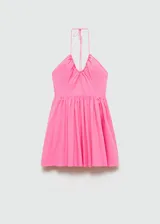 Vestido corto de algodón color rosa, con diseño evasé, escote halter con cuello fruncido y espalda abierta. Cuenta con cierre lateral de cremallera.