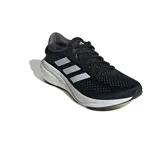 Championes de running Adidas Supernova 2.0, color negro con las icónicas tres tiras laterales en blanco y suela con tecnología de amortiguación blanca.