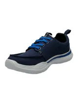 Championes Hush Puppies modelo Alfie Lace, color azul marino con cordones en azul brillante y suela de goma EVA blanca. Presentan un diseño de tela con costuras reforzadas en la puntera y tecnología de confort en la plantilla.