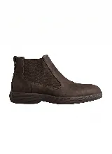 Bota tipo Chelsea de cuero negro con paneles laterales elásticos y suela de goma texturizada.