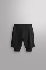 Shorts de entrenamiento azul marino con calza interior negra. Cintura elástica ajustable con cordón, bolsillos laterales con cierre y aberturas laterales en el bajo.