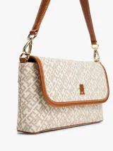 Cartera mensajera con estampado integral del monograma TH, cierre a presión, asa superior extraíble y correa ajustable y extraíble.