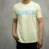 Remera amarilla de algodón con estampa azul de la palabra "Houston" y el número 1982.