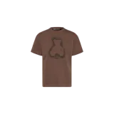 Remera Palm Angels de manga corta en color marrón, con diseño gráfico estampado de un osito estilo graffiti en el centro y tipografía de la marca en el cuello.