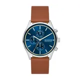 Reloj Skagen con caja de acero inoxidable plateado de 42mm de diámetro, esfera azul con efecto sunray, correa de cuero marrón de 22mm de ancho y cristal mineral. Cuenta con movimiento de cuarzo cronógrafo y resistencia al agua de 3 ATM.