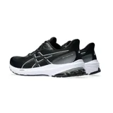 Championes de running Asics modelo GT-1000 12, color negro con detalles en blanco. Presentan una capellada de malla transpirable, entresuela con tecnología FlyteFoam para mayor amortiguación y suela de goma resistente.