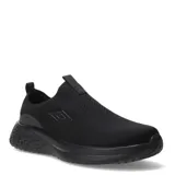 Championes Umbro tipo slip-on de color negro, confeccionados en tejido respirable con diseño sin cordones. Presentan una suela de goma con textura geométrica en el talón y el logo de la marca aplicado en el lateral.