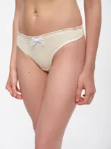 Colaless color crema con elástico festoneado y moño blanco de encaje en el frente.