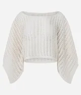 Salida de playa blusa blanca de punto calado, con diseño cropped, cuello bote y mangas largas amplias.