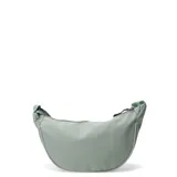 Morral de diseño curvo color verde menta, con cierre superior y correa ajustable.