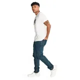 Pantalón de jean de corte slim, color azul oscuro, con cinco bolsillos y logo de CAT en la parte trasera.