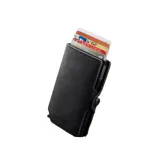 Billetera compacta marca Baleine, modelo Kansas Zipper Full, confeccionada en cuero genuino color negro con estructura interna de aluminio. Cuenta con sistema de deslizamiento para tarjetas, protección RFID, compartimento para billetes y cierre con broche a presión.