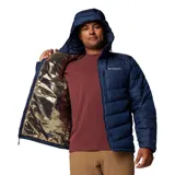 Campera puffer Columbia con tecnología Omni-Heat Infinity y Omni-Shield, color azul marino. Cuenta con capucha, cierre frontal, bolsillos laterales y en el pecho, y puños elásticos.