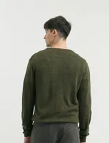 Sweater de punto con escote redondo y manga larga, confeccionado en tejido acrílico de textura suave.