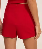 Short pollera corto color marrón de bengalina, con diseño cruzado en el frente, cierre invisible en la parte trasera y talle alto.