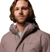 Campera impermeable Columbia modelo Hikebound II, color gris, con capucha ajustable y cierre frontal. Presenta el logo de la marca bordado en el pecho.